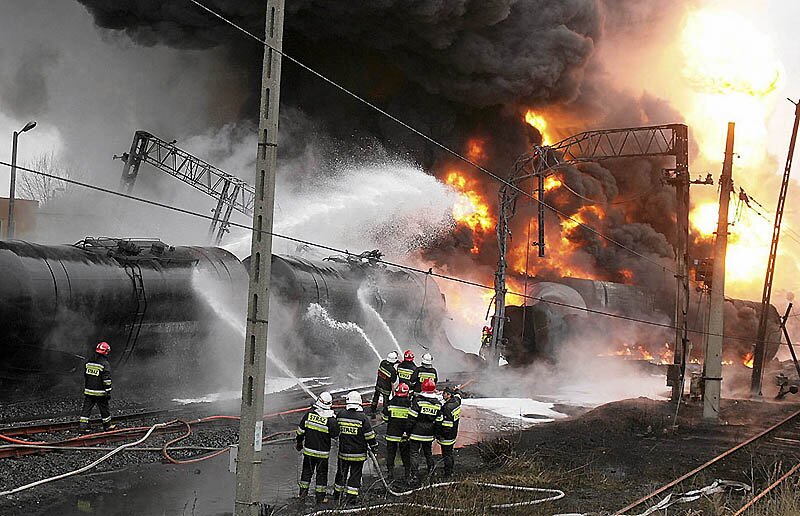 Firefighters battle a blaze caused by explosion on train cars transporting oil in Bialystok, northeastern Poland